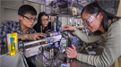 Jiajun Wang, Karen Chen and Jun Wang prepare a sample for study at NSLS beamline X8C.