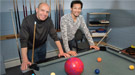 Brookhaven Lab physicist Alexander Bazilevsky and RIKEN physicist Itaru Nakagawa use billiards and a bowling ball to demonstrate surprising results observed at the Relativistic Heavy Ion Collider's PHENIX detector when small particles collided with larger ones.