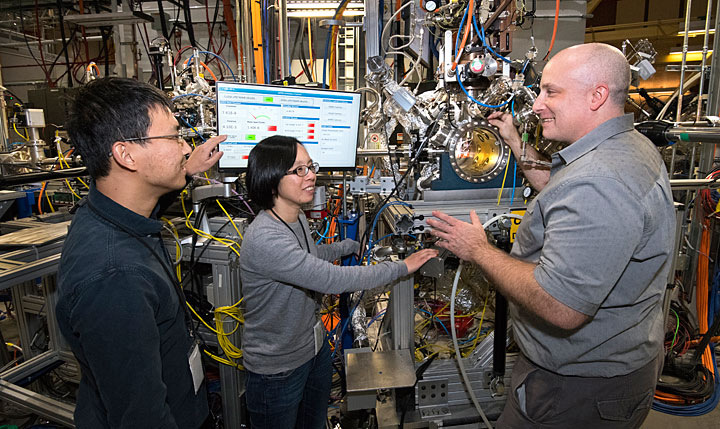 Brookhaven Lab scientists Mingyuan Ge, Iradwikanari Waluyo, and Adrian Hunt are pictured left to right at the IOS beamline, where they studied the growth pathway of an efficient catalyst for hydrogen fuel cells