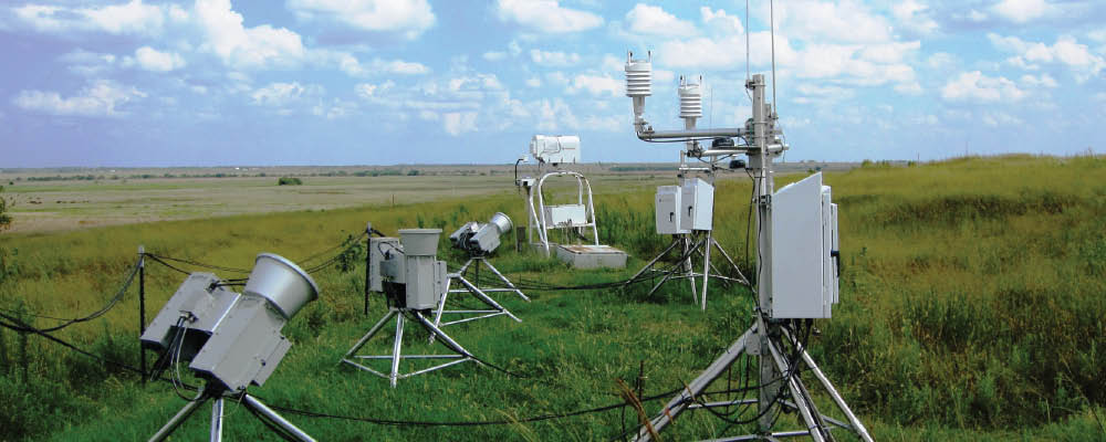 Three new scanning microwave radiometers (left) undergo testing in the instrument field at the Southern Great Plains site's Central Facility.